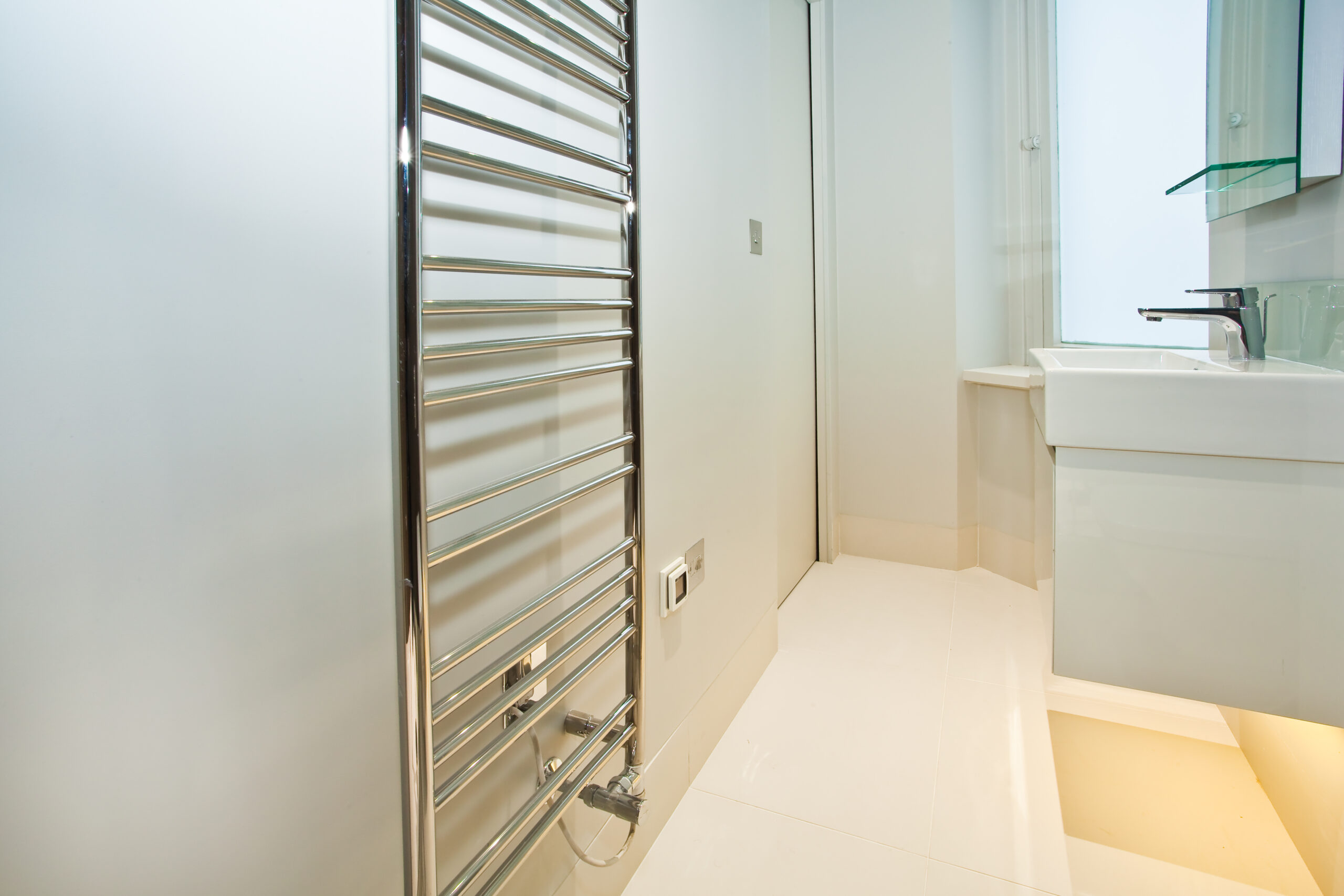 A Stainless Steel Towel Rack in a Bathroom