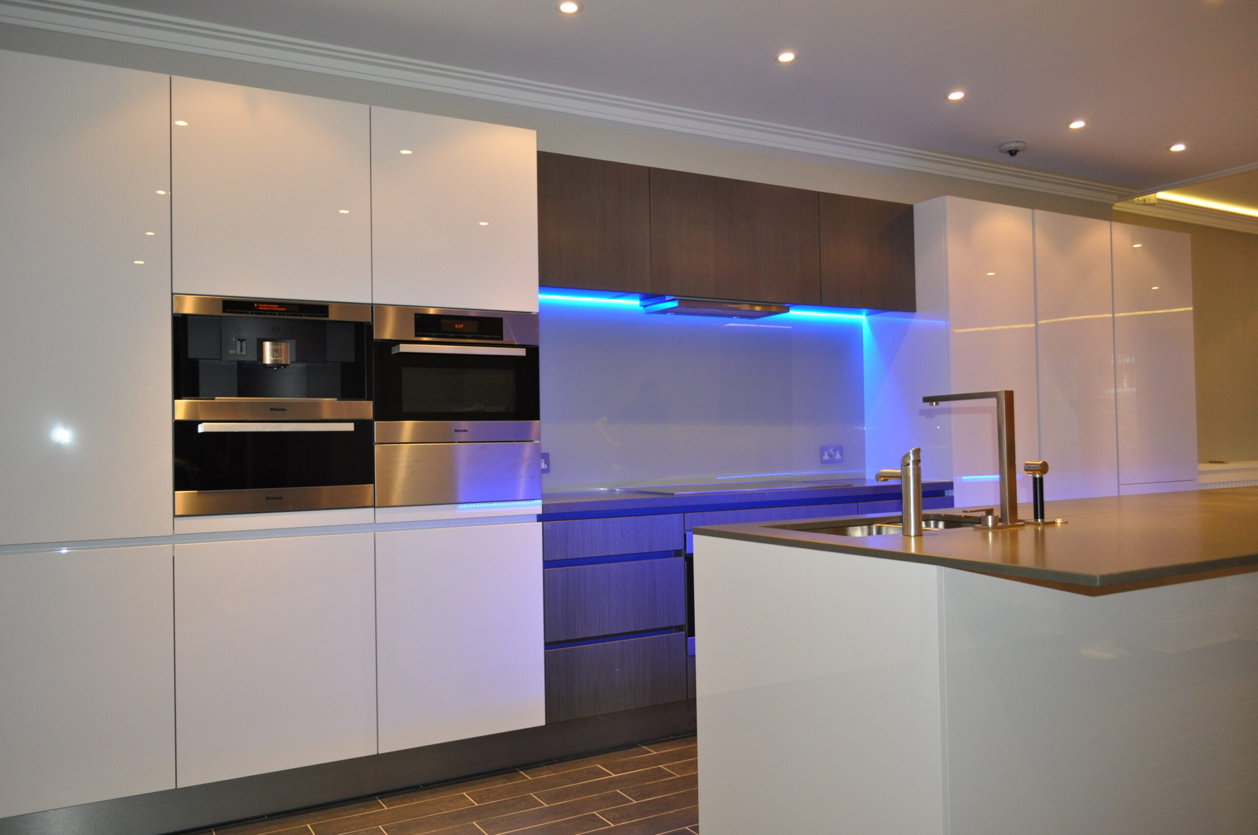 A Kitchen Cooking Station With Blue Lights
