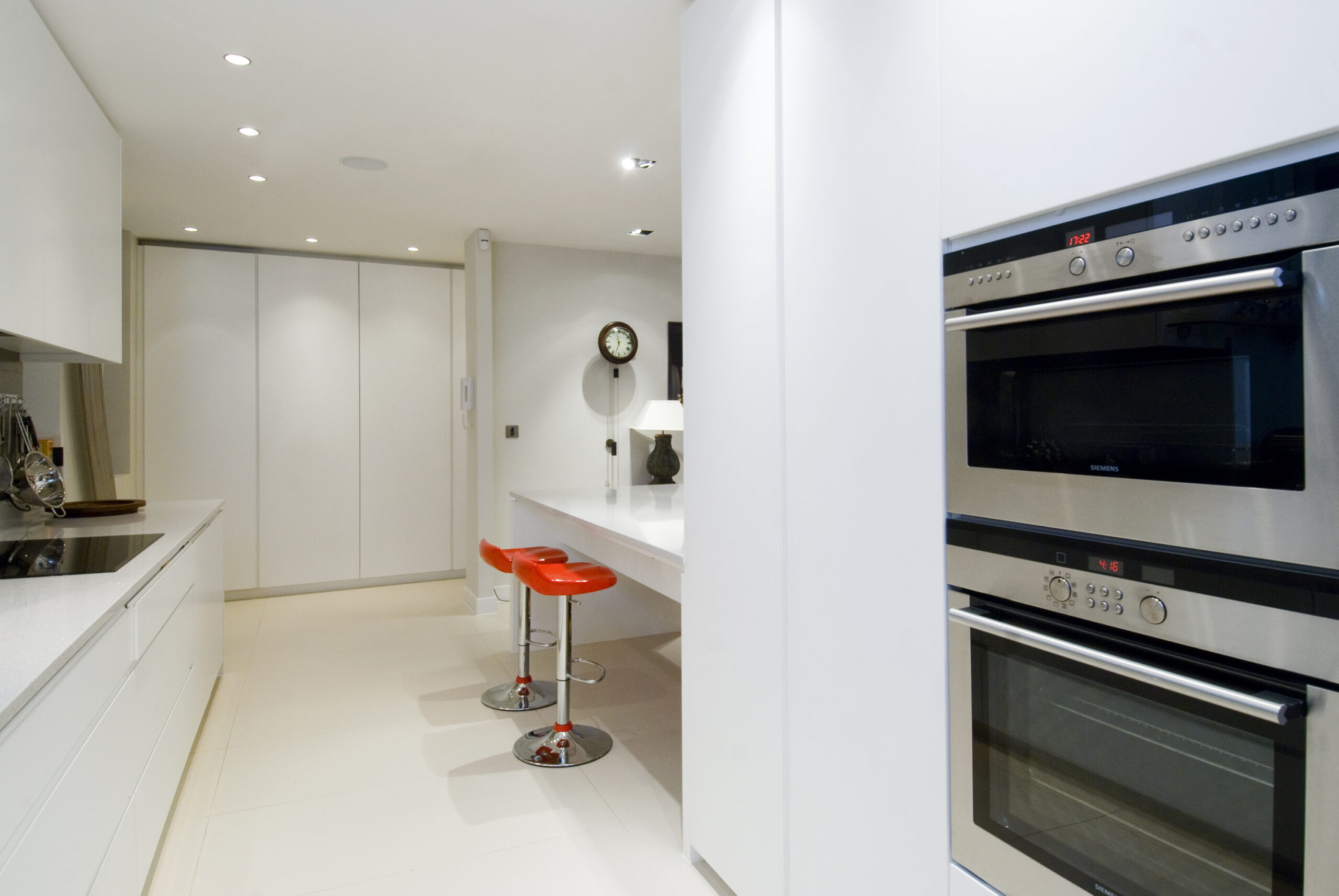 Two Grill Ovens in a Kitchen in White Theme