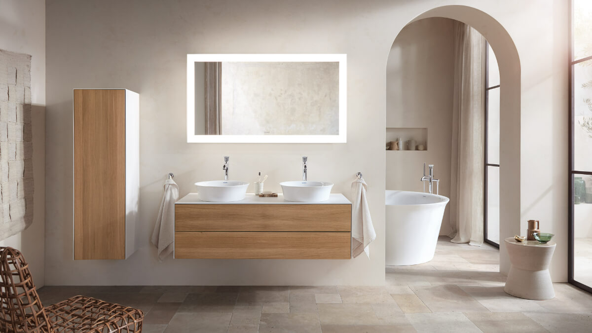 A modern bathroom with wooden cabinets and a bathtub.